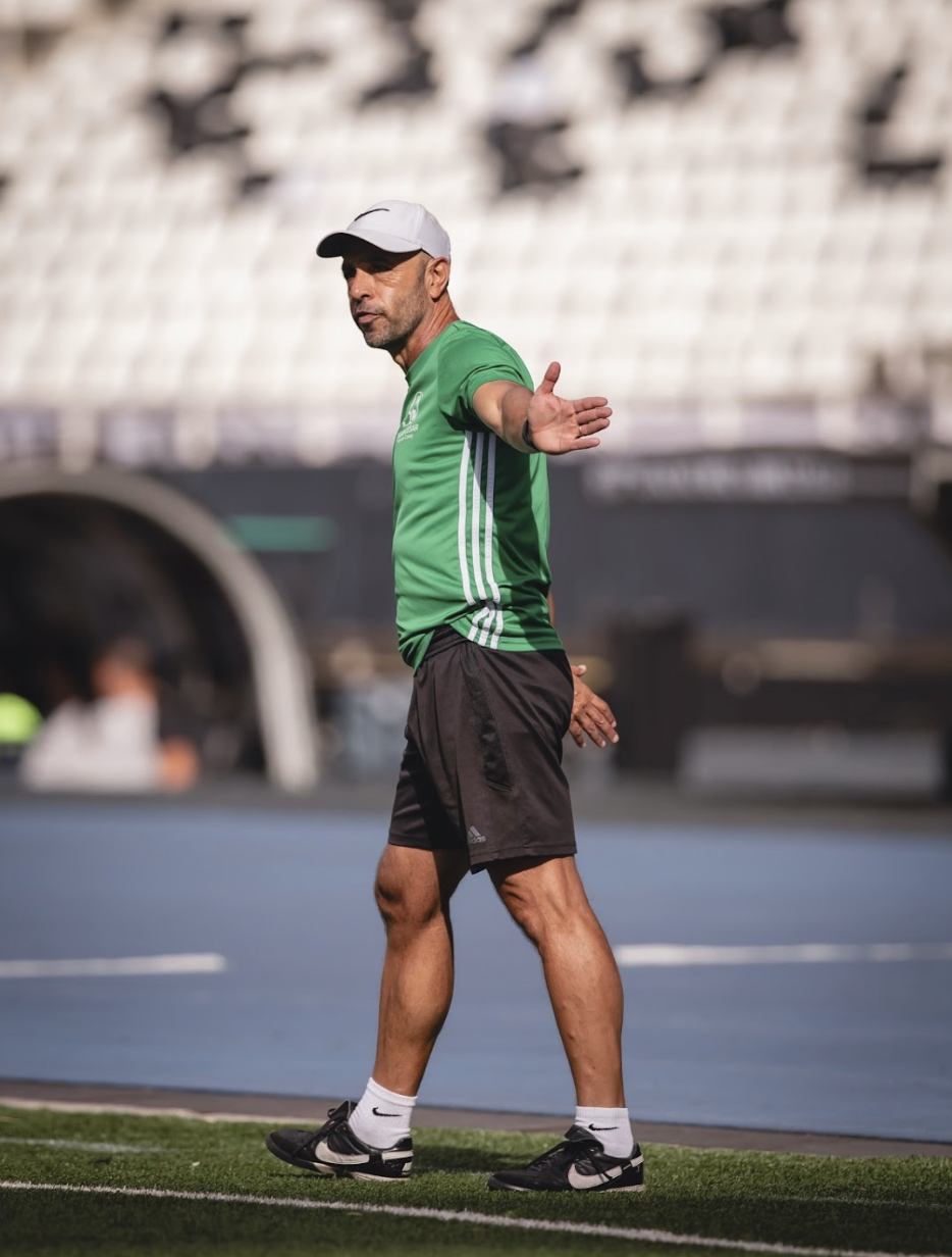 Julio coaching from the touchline in a stadium